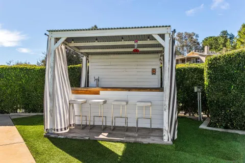 a view of a backyard with sitting area