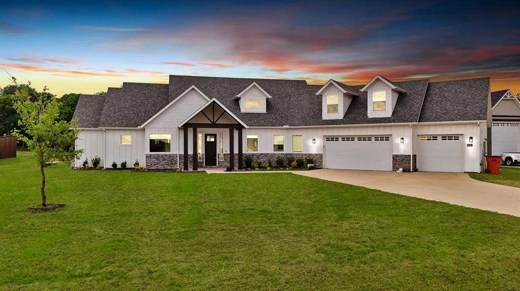 a front view of a house with a yard