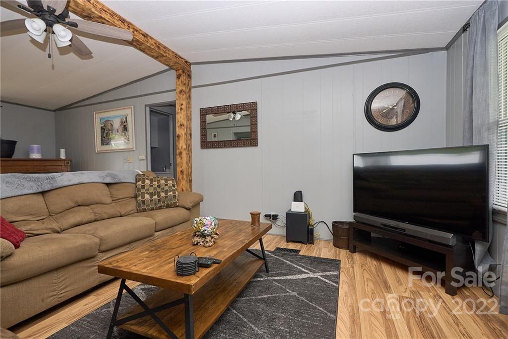 6781 Wright Road Kannapolis, NC 28081 - Photo 13 of 23 a living room with a couch a rug and a flat screen tv