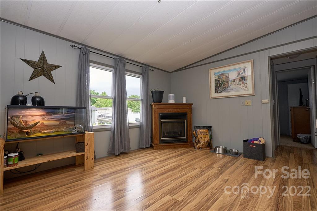 6781 Wright Road Kannapolis, NC 28081 - Photo 14 of 23 a room with furniture and flat screen tv