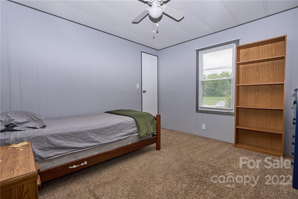 6781 Wright Road Kannapolis, NC 28081 - Photo 21 of 23 a bedroom with a bed and a window