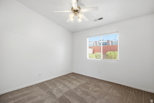 1630 East 2450th Street South, Unit 263 St. George, UT 84790 - Photo 12 of 24 Room featuring light-colored walls and carpeted flooring