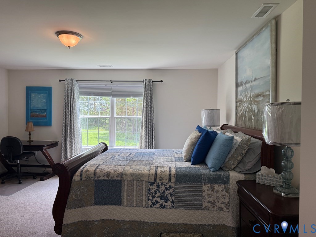 2095 Five Forks Road Pamplin, VA 23958 - Photo 11 of 23 a bed sitting in a bedroom next to a window