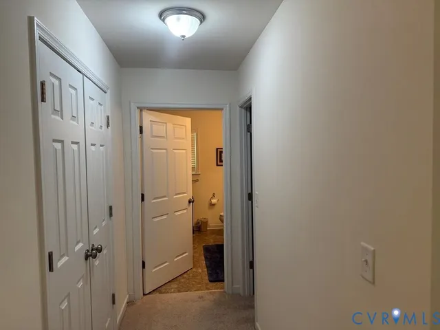 a bathroom with a shower and a glass door