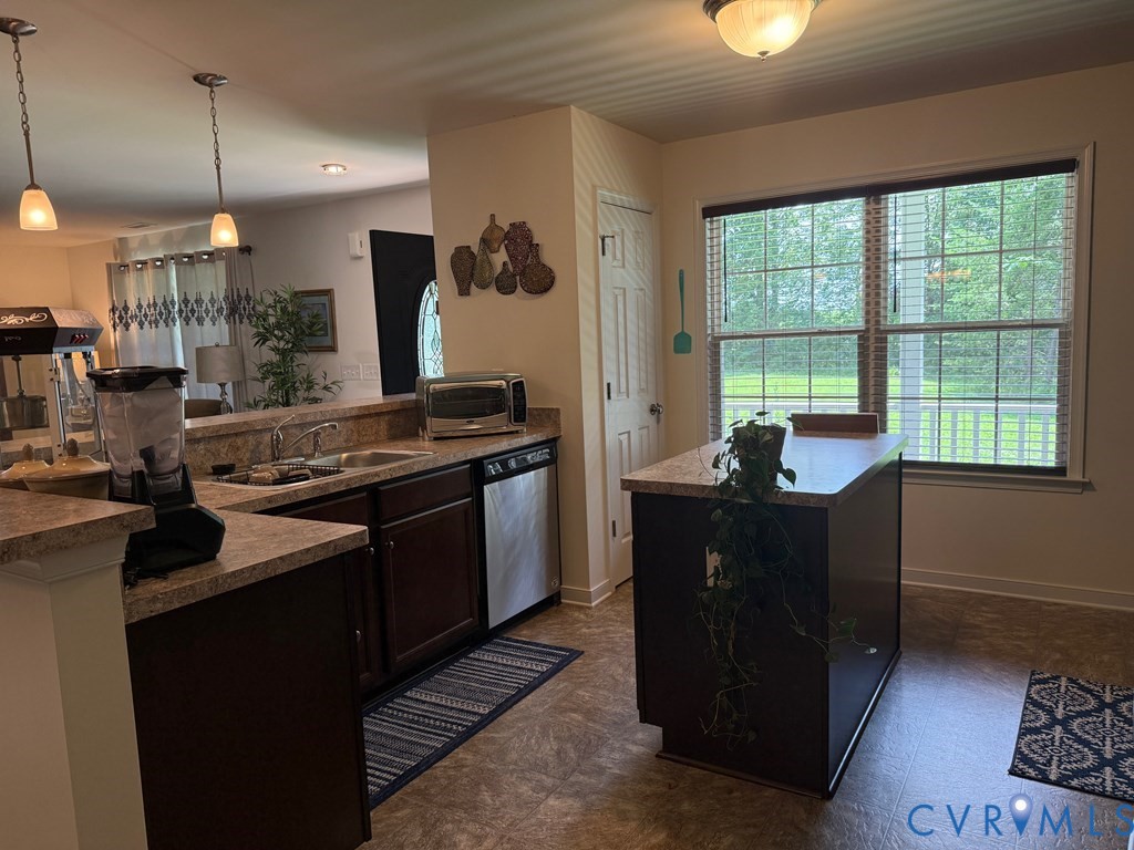2095 Five Forks Road Pamplin, VA 23958 - Photo 8 of 23 a kitchen with a stove window and cabinets