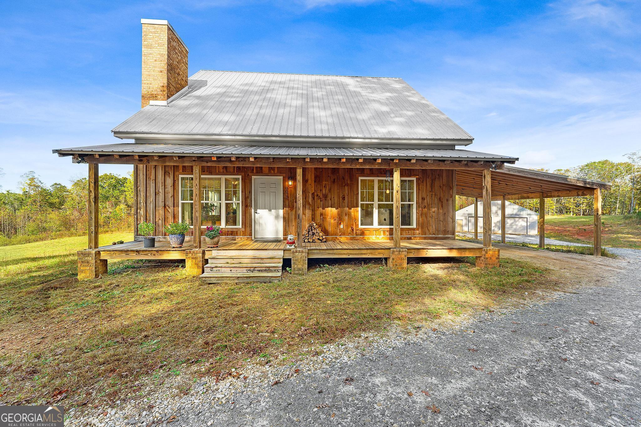 9075 Highway 106 Hull, GA 30646 - Photo 1 of 1 a view of a swimming pool with a patio