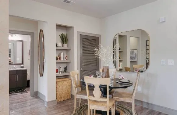 a view of a dining room with furniture and wooden floor