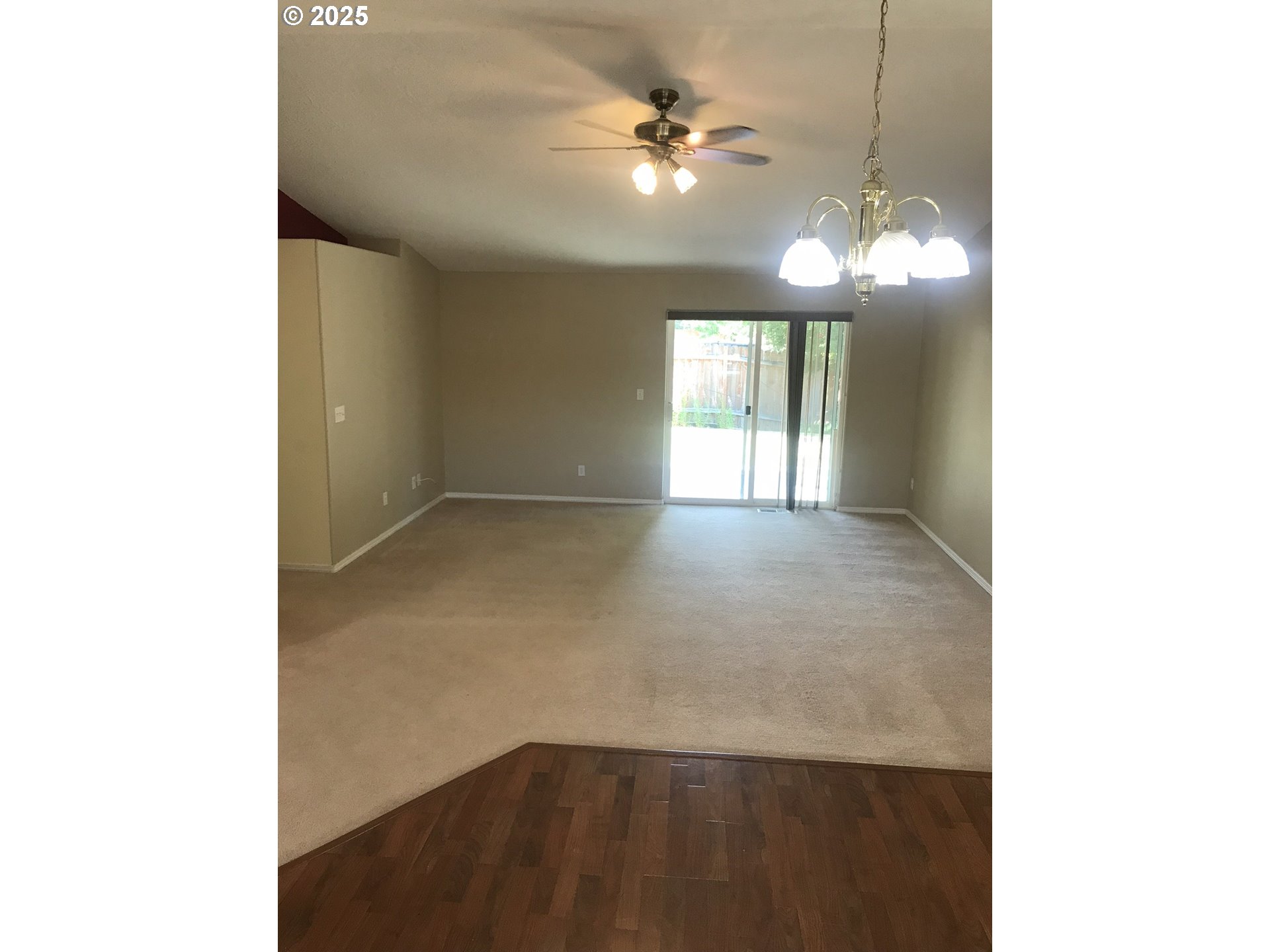 1066 Southwest Aspen Lane Dallas, OR 97338 - Photo 2 of 10 a view of a livingroom with a ceiling fan and window