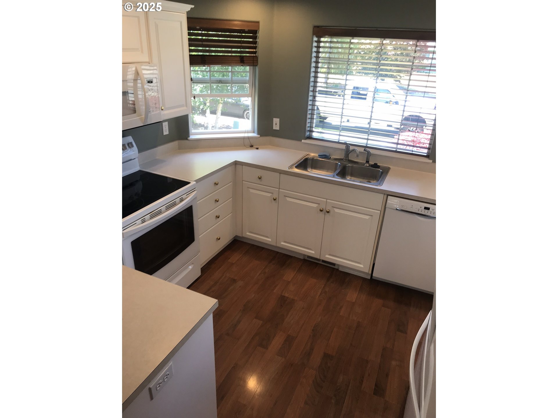 1066 Southwest Aspen Lane Dallas, OR 97338 - Photo 3 of 10 a kitchen with stainless steel appliances a sink and a window