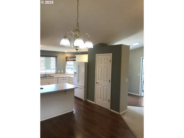 a view of a kitchen from the hallway