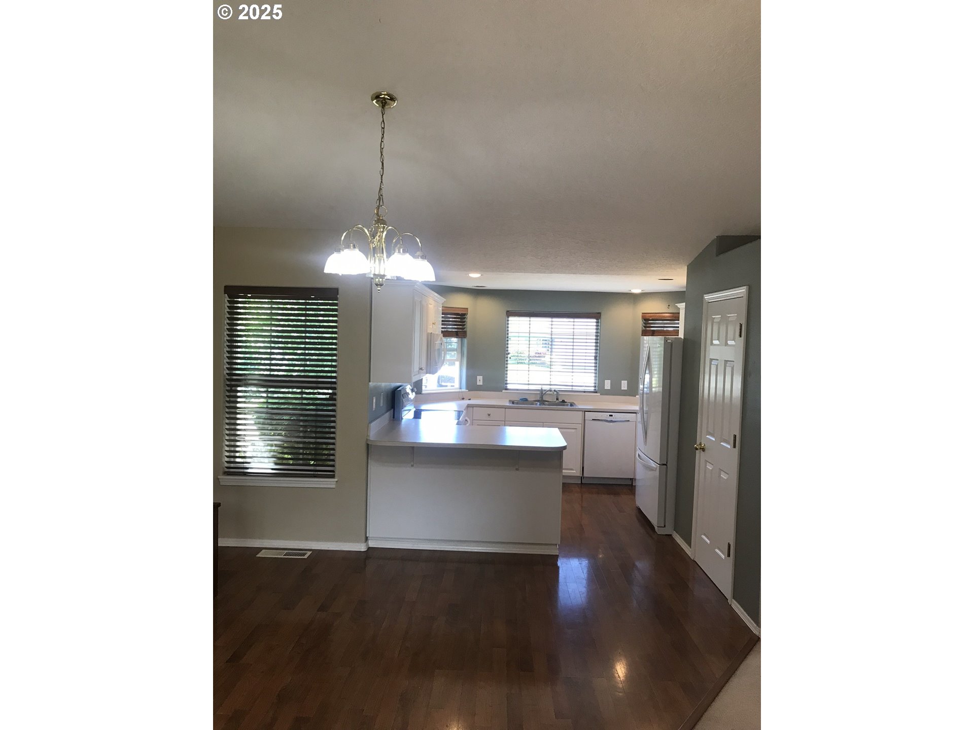 1066 Southwest Aspen Lane Dallas, OR 97338 - Photo 8 of 10 a view of a living room with a sink
