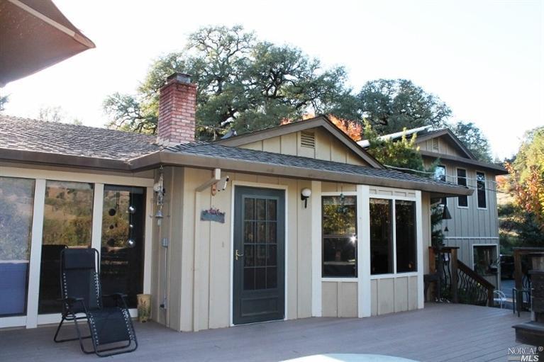 1171 Riverside Drive Ukiah, CA 95482 - Photo 1 of 1 a front view of a house with glass windows
