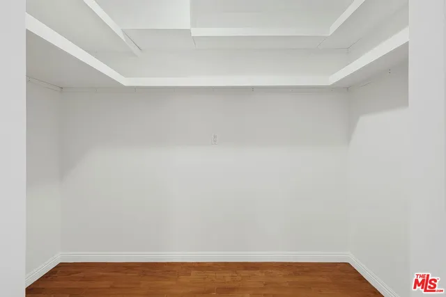 a view of room with wooden floor