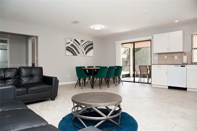 a living room with furniture and a table