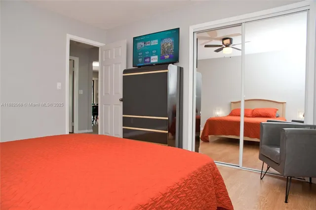 a bedroom with a bed and a table in it