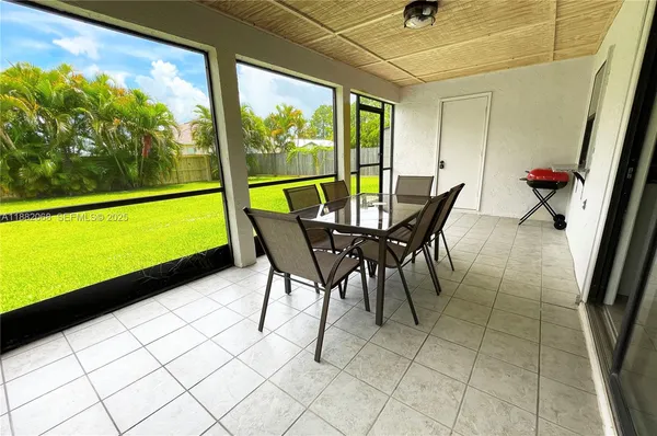 a view of a dining room with furniture window and outside view