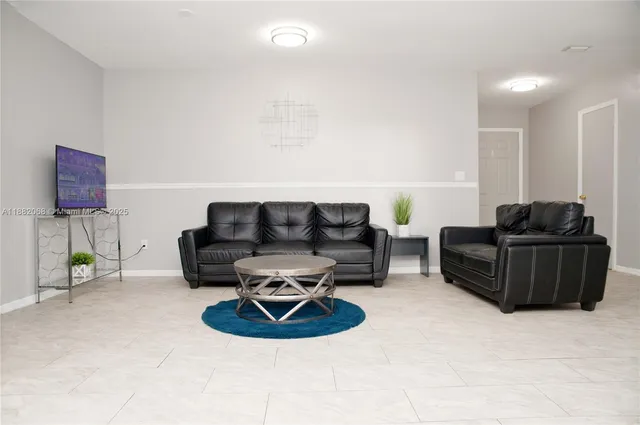 a living room with furniture and a couch