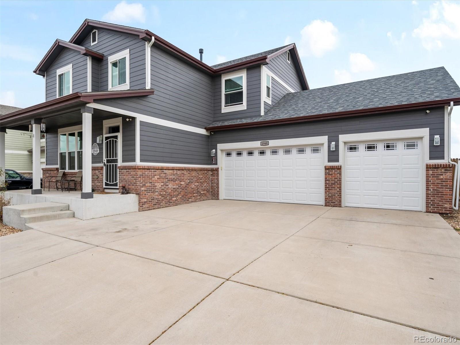 a front view of a house with a garage