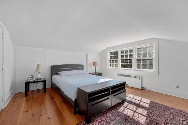 a bed room with a bed and a window