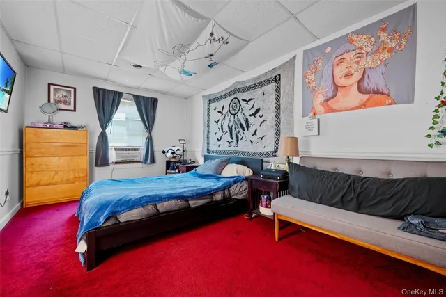 a bedroom with a bed and dresser