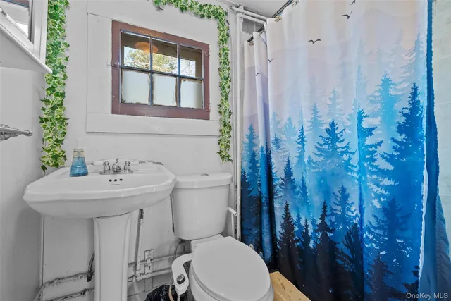 a bed room with a bed and a flat screen tv