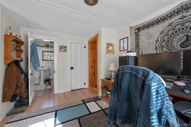 a bathroom with a white toilet sitting next to a sink
