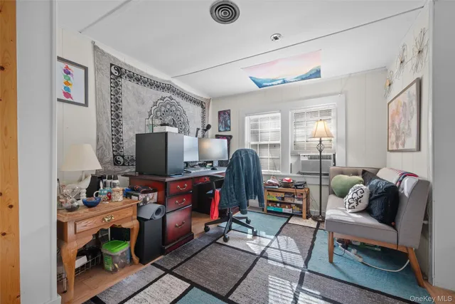 a view of a workspace with furniture and workspace