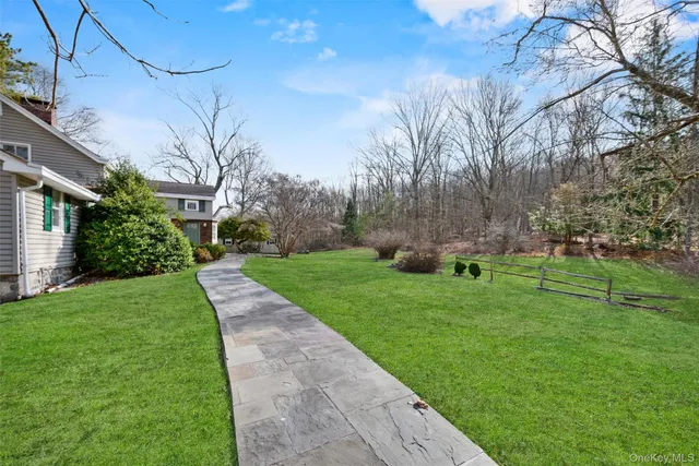 a view of a house with a big yard