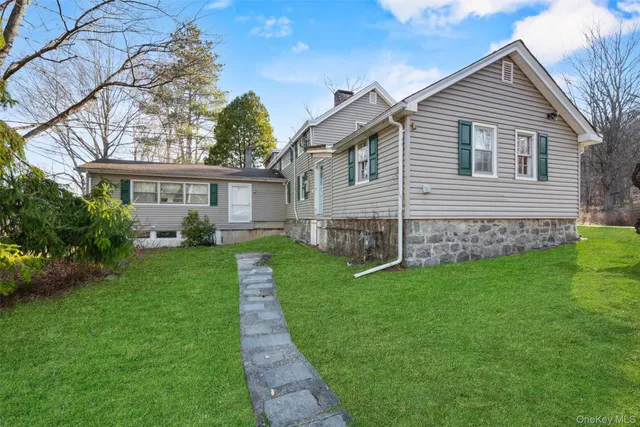 a view of a backyard with table and chairs and a fire pit