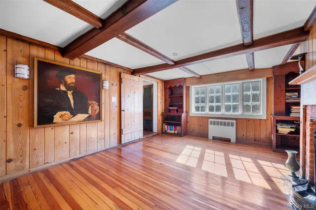 a view of livingroom with furniture window and wooden floor