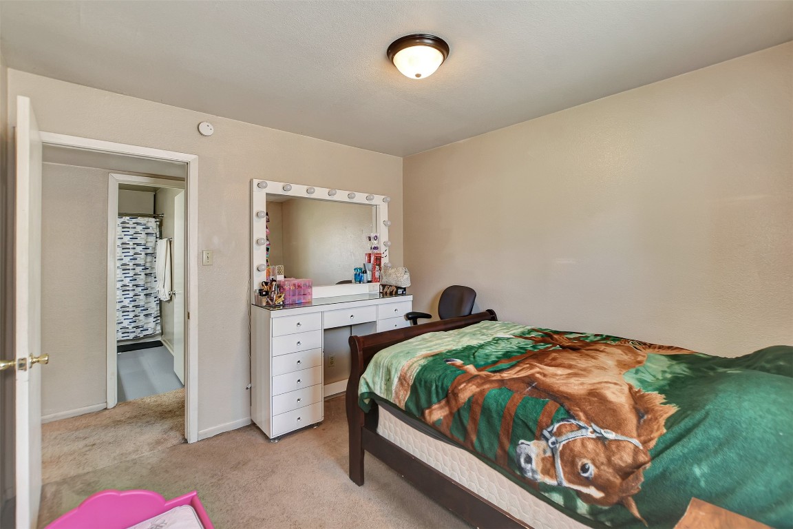 1920 6th Street Hempstead, TX 77445 - Photo 20 of 29 a bedroom with a bed and a mirror