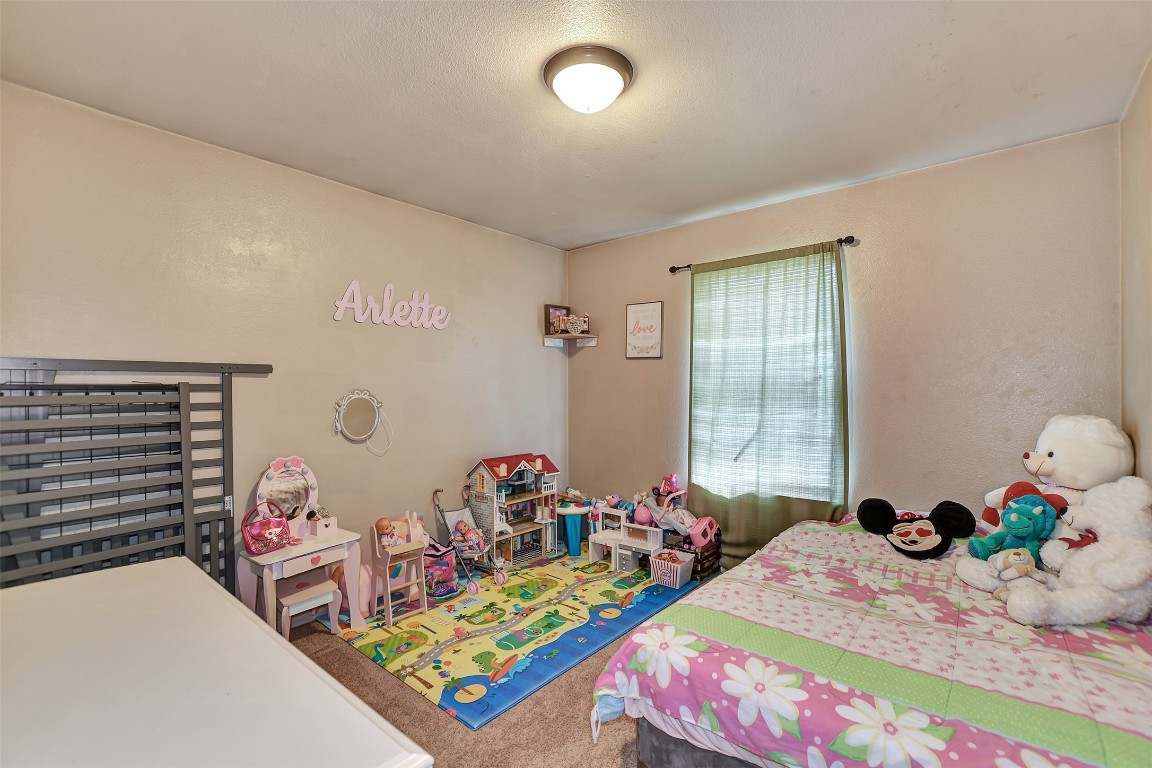 1920 6th Street Hempstead, TX 77445 - Photo 23 of 29 a bed room with two beds and a window