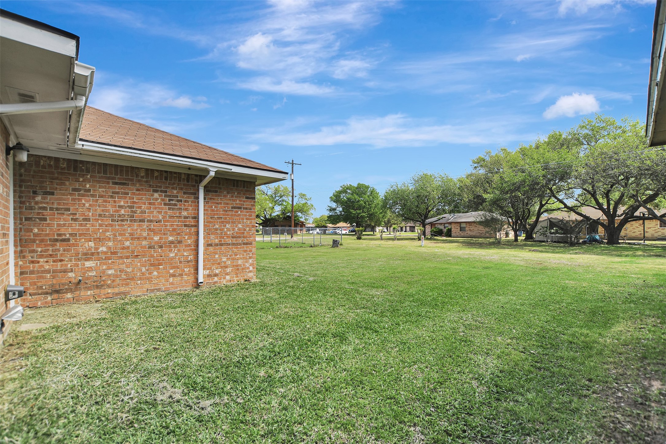 1920 6th Street Hempstead, TX 77445 - Photo 28 of 29 Large, open backyard with plenty of space to create your ideal outdoor setup—endless potential for entertaining, gardening, or future improvements.