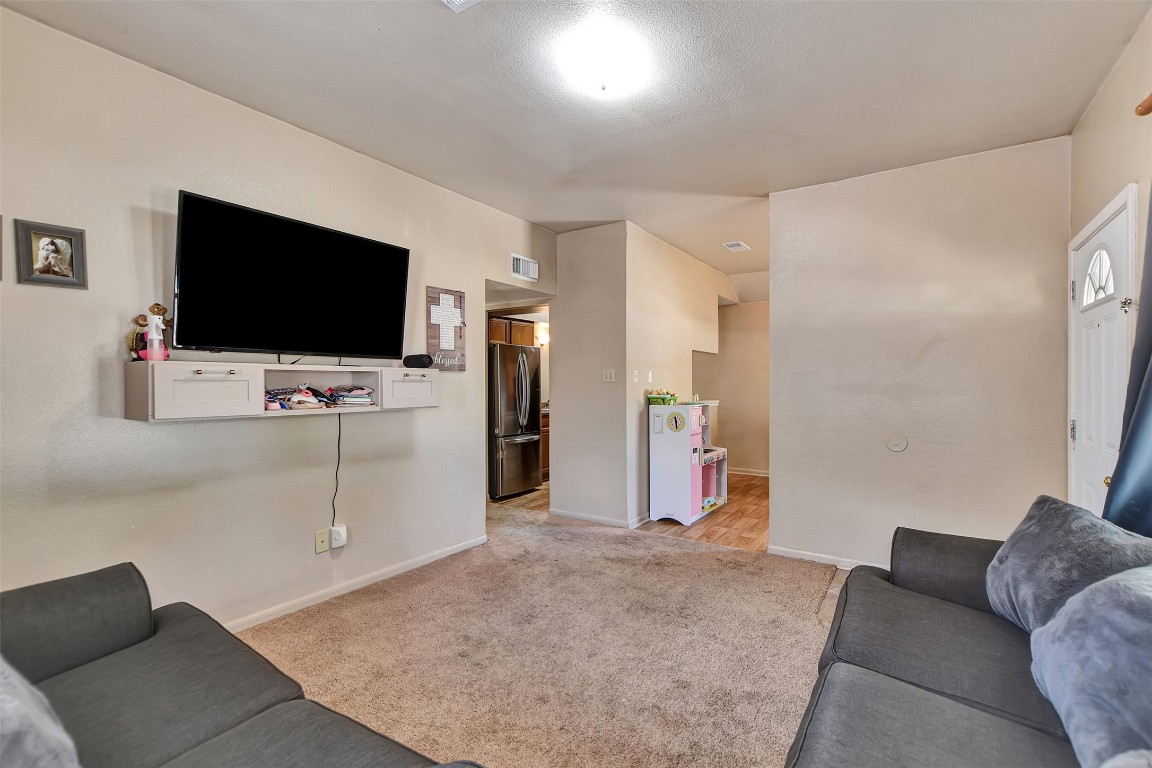 1920 6th Street Hempstead, TX 77445 - Photo 6 of 29 a living room with furniture and a flat screen tv