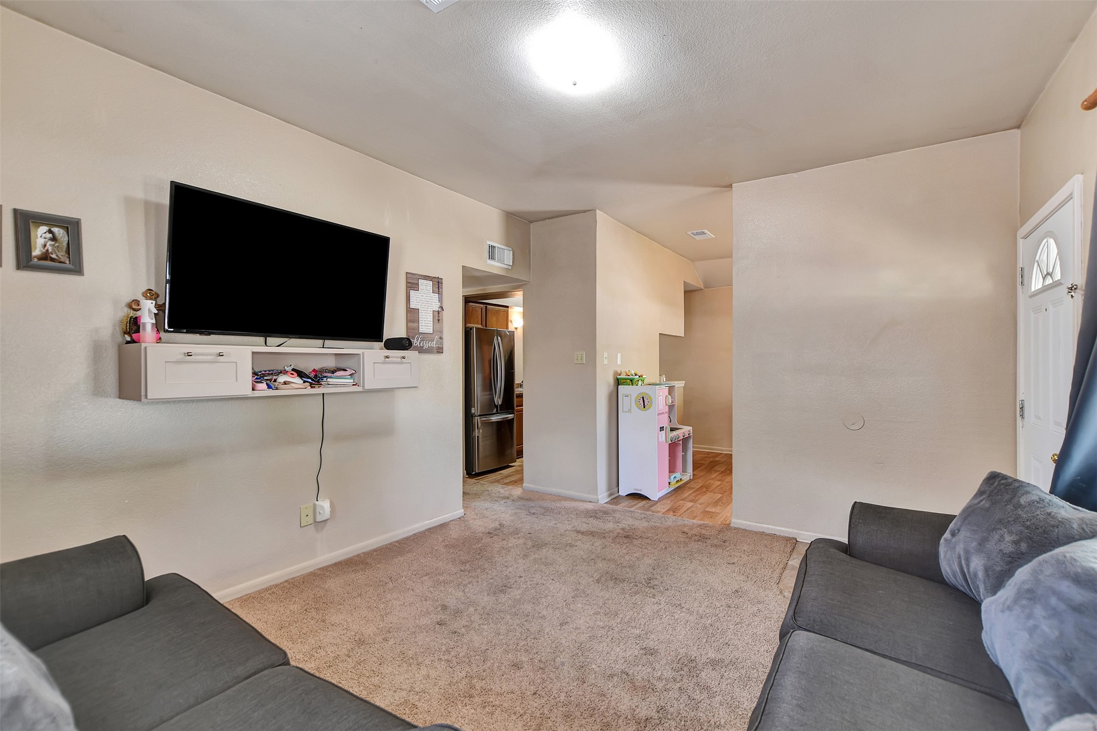 1920 6th Street Hempstead, TX 77445 - Photo 6 of 29 Side view from living room providing access to both dining room and kitchen!