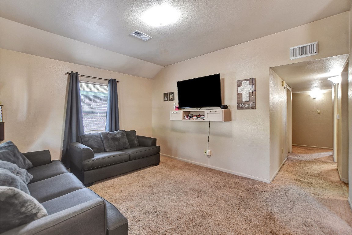 1920 6th Street Hempstead, TX 77445 - Photo 8 of 29 a living room with furniture and a flat screen tv