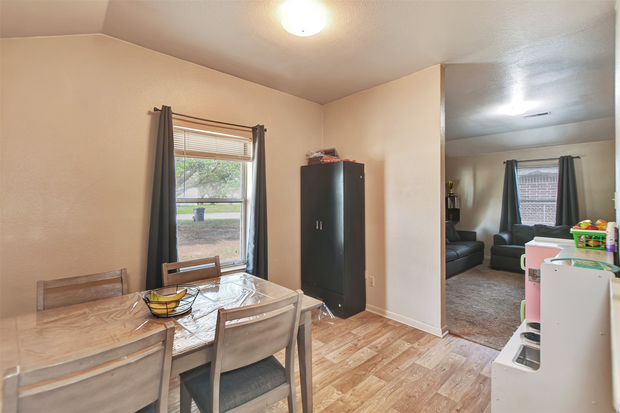 1920 6th Street Hempstead, TX 77445 - Photo 9 of 29 Open dining space conveniently located between the living room and kitchen—perfect for gatherings and easy meal service.