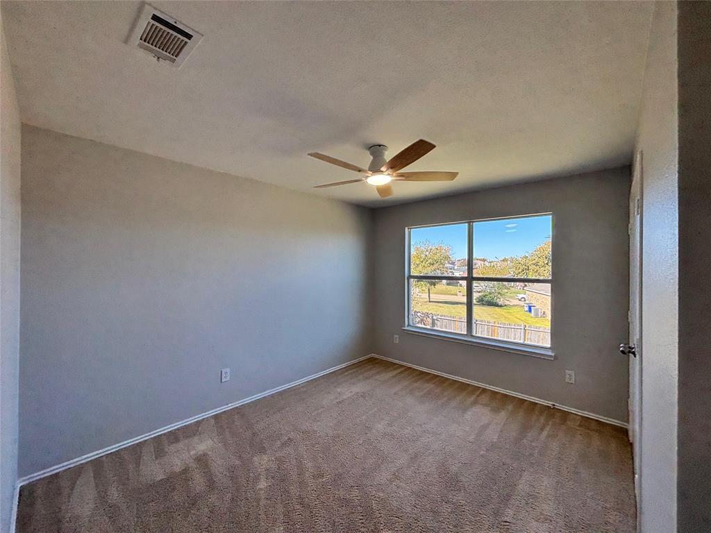 1003 Windsor Lane Forney, TX 75126 - Photo 16 of 20 a view of an empty room with a window