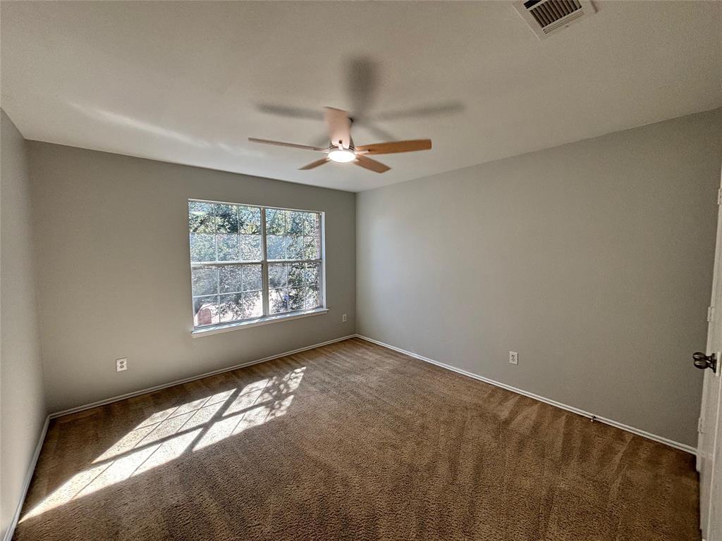 1003 Windsor Lane Forney, TX 75126 - Photo 18 of 20 a view of an empty room with a window
