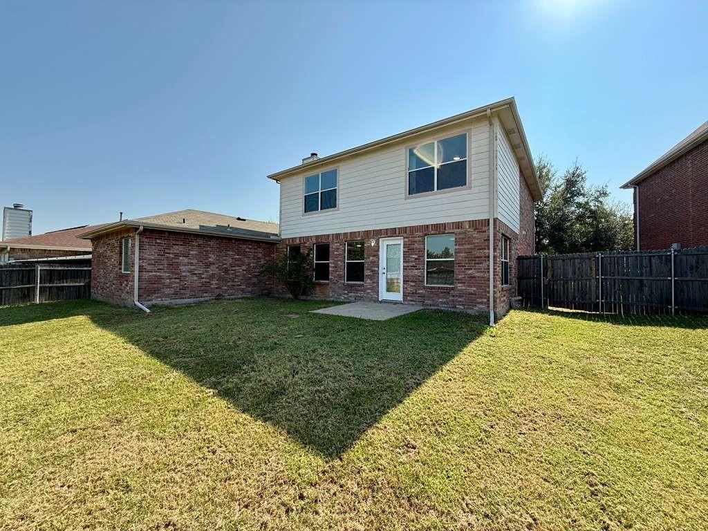 1003 Windsor Lane Forney, TX 75126 - Photo 20 of 20 a view of a house with a backyard