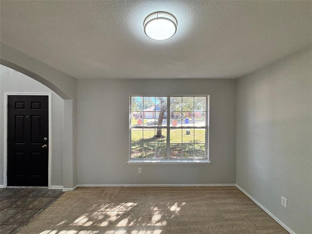 1003 Windsor Lane Forney, TX 75126 - Photo 6 of 20 an empty room with a window