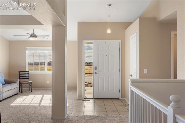 8271 Del Rio Road Peyton, CO 80831 - Photo 2 of 34 Front entry open to the formal living room.