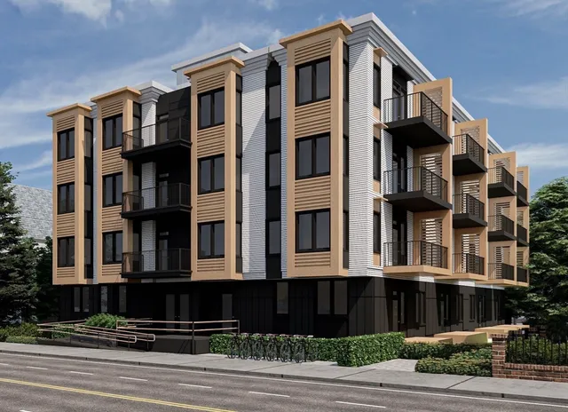 a front view of a building with a yard