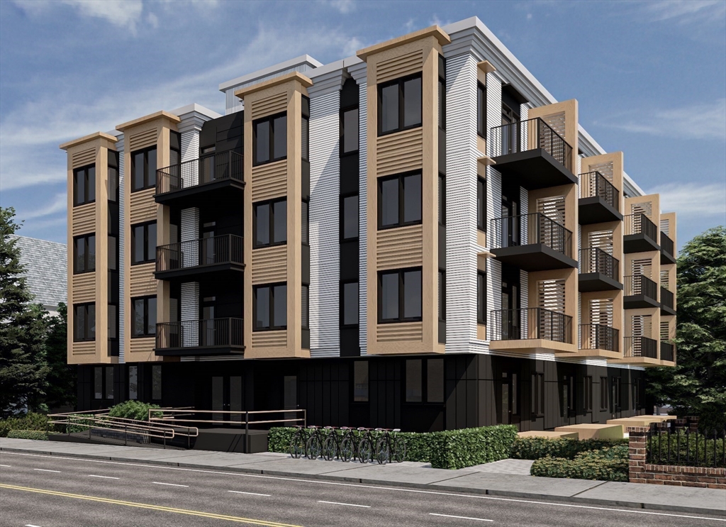 a front view of a building with a yard