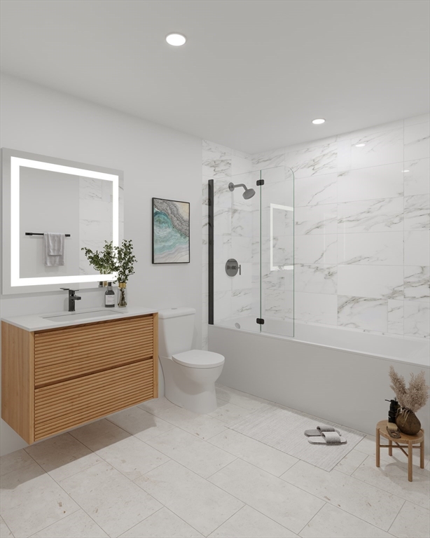 84 Prospect Street, Unit 101 Somerville, MA 02143 - Photo 5 of 6 a bathroom with a sink a toilet and shower