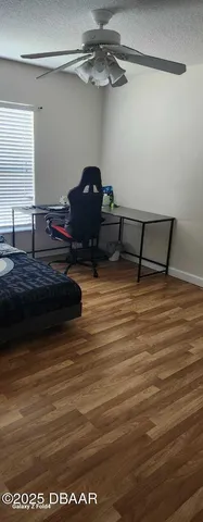 a view of room with wooden floor