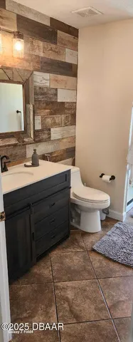 a bathroom with a toilet and a sink