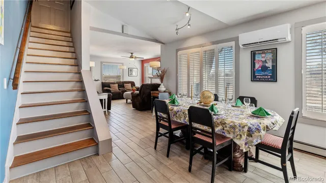 a view of a livingroom with furniture and wooden floor
