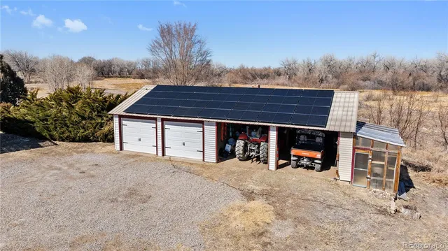 a view of a house with a snow in the yard