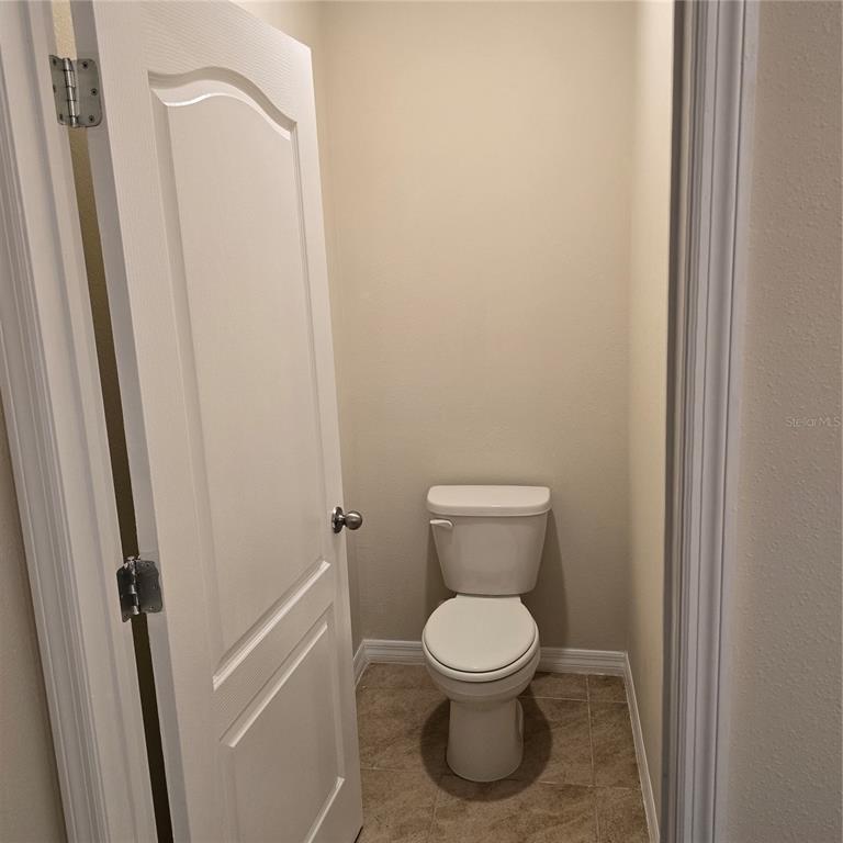 814 Sun Burst Road Winter Haven, FL 33880 - Photo 25 of 48 a white toilet sitting next to a shower